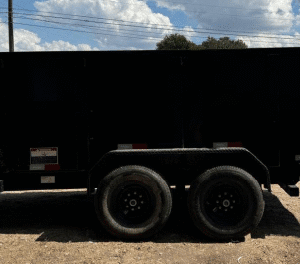 A Train Carriage On Wheels On Grass